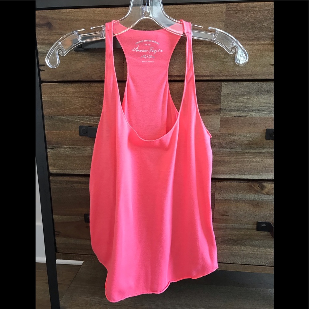 Bright coral pink racerback tank in size Small